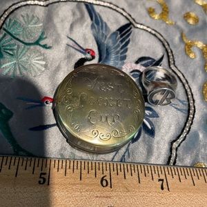 Vest. Pocket cup and sterling pinky ring